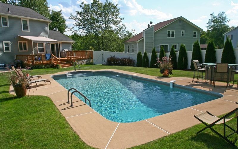 This is a photo of a patrician in ground pool in Germantown, NY with custom pavers and steps.