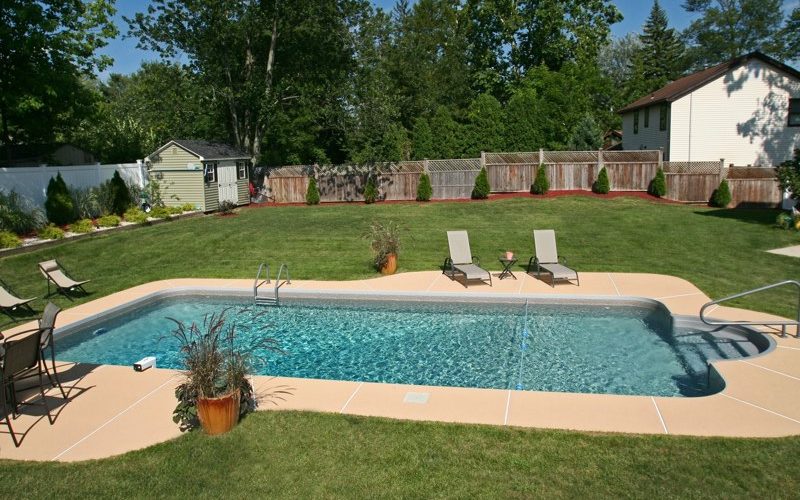 This is a photo of a patrician in ground pool in Germantown, NY with custom pavers and steps.