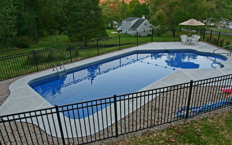 This is a photo of a Lazy L style custom inground swimming pool.