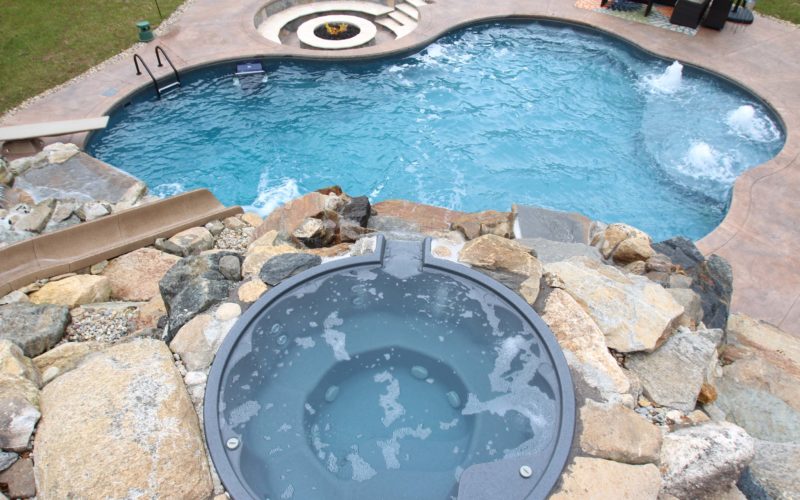 Custom inground pool and hot tub installed by Majestic Pools